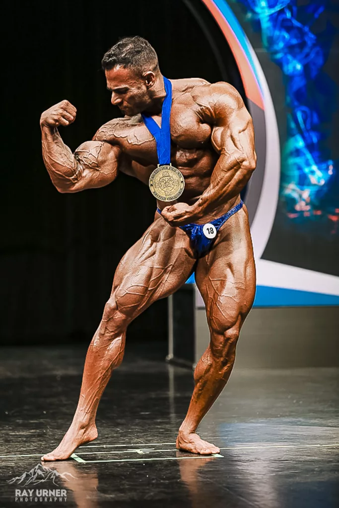 Mahmood Al Durrah rstrikes a pose with his first place medal after winning the 212 category at the 2018 Vancouver Pro