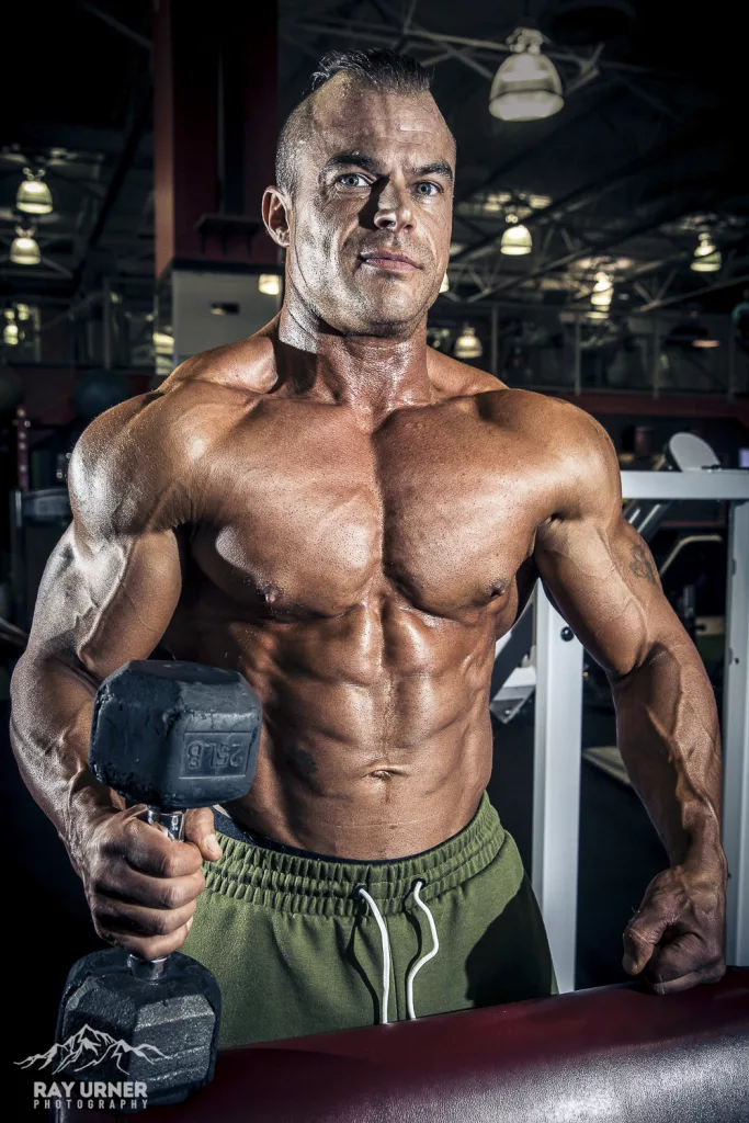 Bodybuilder posing with a dumbbell