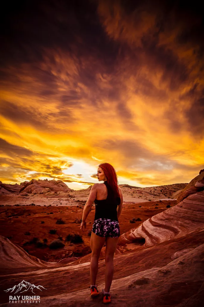 IFBB figure competitor Mandy Urner at Fire Wave at the Valley of Fire in Las Vegas, walking into the sunset.
